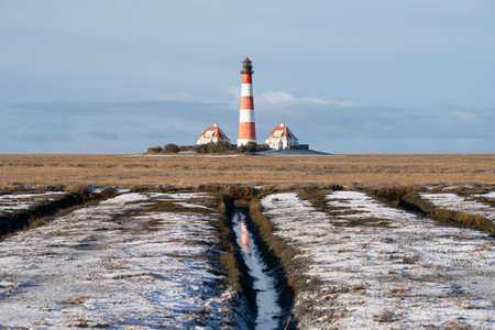 Panoramic image of Westerhever lighthouse during wintertime, North Frisia, Germanyの写真素材