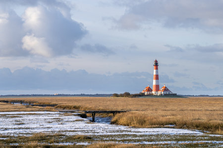 Panoramic image of Westerhever lighthouse against sky, North Frisia, Germanyの写真素材