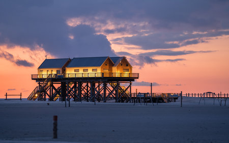 SANKT PETER ORDING, GERMANY - MARCH 8, 2023: Panoramic image of beach houses of Sankt Peter Ording close to the North Sea on March 8, 2023 in North Frisia, Germanyのeditorial素材