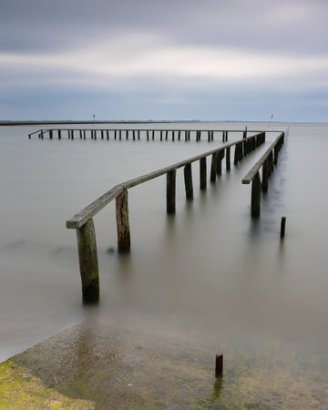 Panoramic image of Wadden Sea against sky on a dully day, North Frisia, Germanyの写真素材
