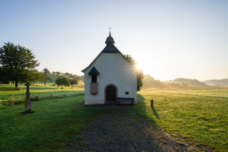 Small Feinten Chapel close to Wittlich against sunrise, Rhineland Palatinate, Germanyの写真素材