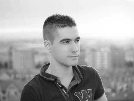 black and white man looking at right with landscape cityの写真素材