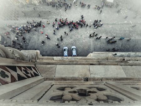 Florence tourists and police cars from Giotto's bell tower seen from aboveの写真素材
