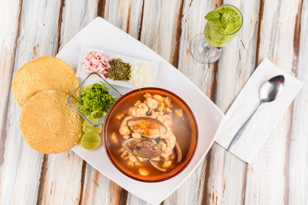 Mexican dish, Veracruz style pozole with crabs and seafood accompanied by tortillas and tostadasの写真素材