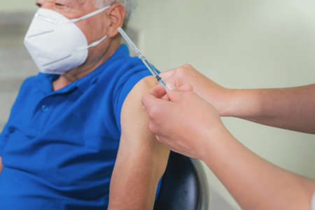 close-up view of the vaccination process in the elderlyの写真素材