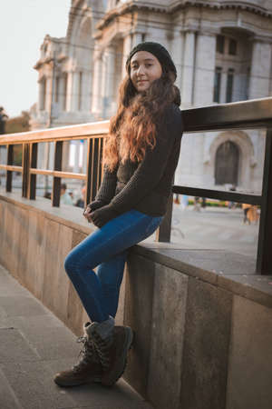 Young girl posing with warm clothes