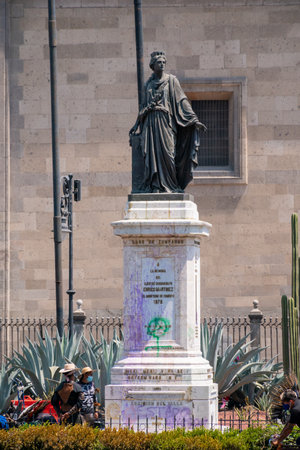 Mexico, Mexico City March 13, 2021, in the street of "Monte de Piedad" you can see the monument in memory of "Enrico Martinez" who has been vandalized with graffiti in the march for women's day.のeditorial素材