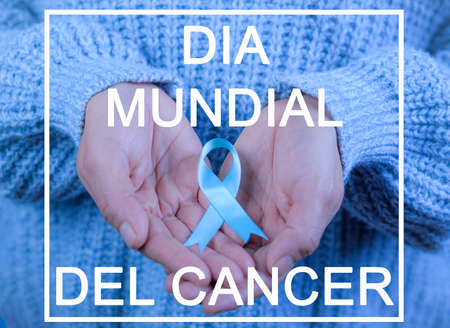 November Prostate Cancer Awareness Month, A Woman's Hands Holding Blue Ribbon in Support of People...