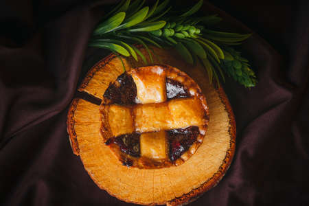 Homemade blackberry cake on a wooden surface with black background, gourmet bakery. Traditional Mexican sweet bread.の写真素材