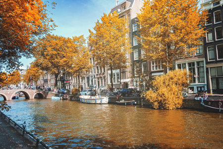 August 20, 2025, Amsterdam, Netherlands, view of the houses on the Oudezijds Voorburgwal river, a beautiful sunset in a beautiful neighborhood.の写真素材