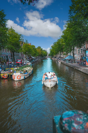 August 20, 2025, Amsterdam, Netherlands, view of the Oudezijds Voorburgwal river from the bridge on Oude Doelenstraat street.の写真素材