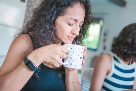 Family enjoys breakfast in the morning, consisting of eggs with toast and coffee.