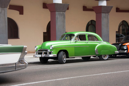 HAVANA, CUBA - APRIL 01, 2017: American classic car from the 50s in green color parked in central street of the city of Havana, Cubaのeditorial素材