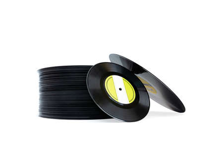 Many vinyl discs in LP format stacked in a tower on a white background. Isolated. Space for text....