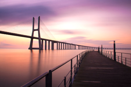 Long exposure shot at daybreak on Vasco da Gama Bridge. Lisbon, Portugal. Space for text.の写真素材