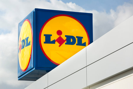 MADRID, SPAIN - FEBRUARY 13, 2022: Advertising poster with the logo of the German multinational discount supermarket chain Lidl.のeditorial素材