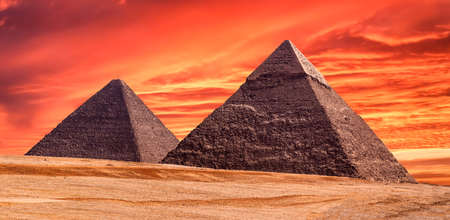 Panorama of the area with the great pyramids of Giza at amazing sunset, Egypt