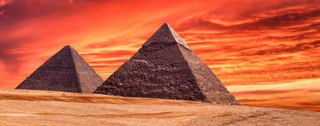 Panorama of the area with the great pyramids of Giza at amazing sunset, Egyptの写真素材