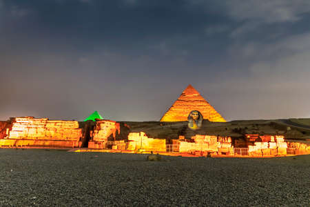 Giza pyramids and Sphinx light up at nightの写真素材