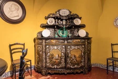 Queluz, Portugal - December 7, 2017: Set of furniture made in papier-mÃ¢chÃ© with inset mother of pearl at the Atelier of the Countess of Edla.のeditorial素材