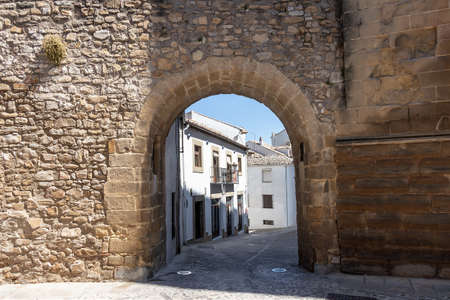 Arco de las Escuelas o de San Leon in street Conde Romanones, Baeza, Jaen province, Andalucia, Spainのeditorial素材