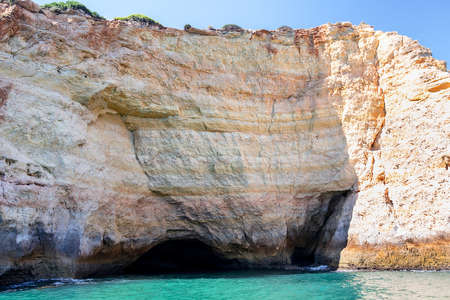 Benagil Caves from the Sea Side. Beautiful Natural Sea Cave with emerald water and Atlantic Ocean in Carvoeiroの写真素材