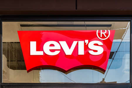 Huelva, Spain - July 27, 2020: A Leviâs Store logo above the entrance to one of the stores in Holea Shopping center. Leviâs is an American maker and retailer of denim clothingのeditorial素材