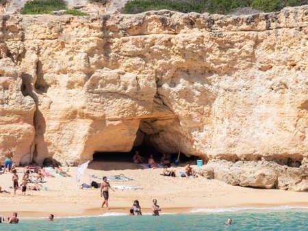 Lagoa, Portugal - July 11, 2020: View from the sea of one of Carvoeiro beach. The Lagoa region has a coastline formed of towering cliffs, turquoise waters and picturesque beaches.のeditorial素材