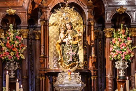 Huelva, Spain - September 8, 2020: Altar of the sanctuary Virgen de la Cinta on the day of her festivity, with bouquets of flowers as an offering. church on El Conquero hill in Huelva, Andalusia Spainのeditorial素材
