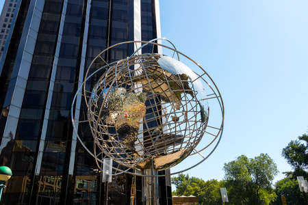 New York City, USA - June 12, 2017: The Globe Sculpture and the Trump Hotel and Tower at Columbus Circleのeditorial素材