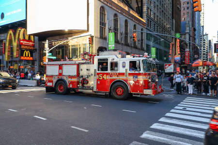 New York City, USA - June 7, 2017: FDNY Emergency Truck Passing Fast at sunset in Times Square, New...