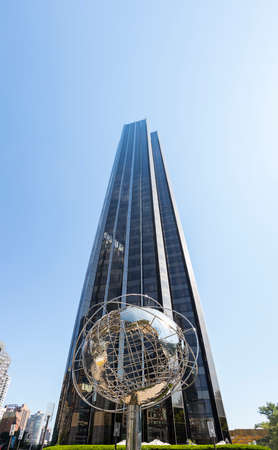 New York City, USA - June 12, 2017: The Globe Sculpture and the Trump Hotel and Tower at Columbus...