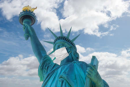 Statue of Liberty with a protective medical mask. COVID-19 coronavirus quarantine