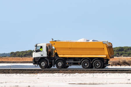 Truck loaded with marine salt in nature reserve Marismas del Odiel. Traditional Sea salt production is salt that is produced by the evaporation of seawater.の写真素材