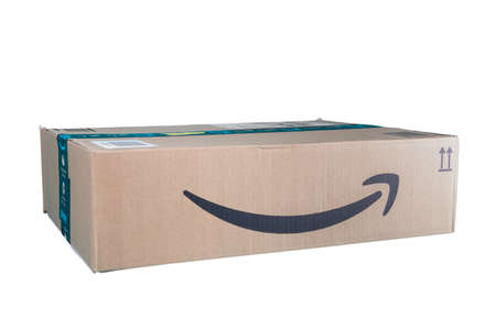 Huelva, Spain - October 5, 2020: Amazon Prime parcel over white background. Prime is a service offered by online retailer Amazon for faster delivery of orders.のeditorial素材