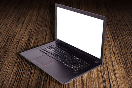 Black laptop with screen in 90 degree over a table. Notebook with empty screen. blank copy space on...