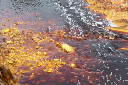 Stones in Rio Tinto river, Huelva, Andalusia, Spain