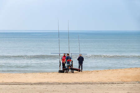 Huelva, Spain - March 7, 2021: People practicing sport fishing with rod from the seashoreのeditorial素材