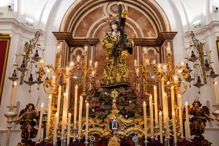 Huelva, Spain - April 1, 2021: Procession of the Brotherhood of Our Father Jesus Nazareno exhibited in the Parish of the Immaculate Conception of Huelva on the occasion of Holy Week 2021.のeditorial素材
