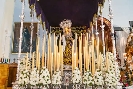 Huelva, Spain - April 1, 2021: Procession of Our Lady of Calvary inside the Parroquia Mayor de San Pedro de Huelva exhibited on the occasion of Holy Week in 2021. The focus is on Christ with the crossのeditorial素材