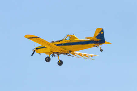 Huelva, Spain - June 27, 2021: ADEFA (Agricultural Fumigation Aircraft). Air Tractor AT-502B (EC-IVX) carrying out fumigation work against mosquitoes in the province of Huelva, Andalusia, Spainの写真素材