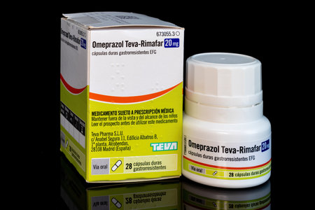 Huelva, Spain - August 27, 2021: Spanish bottle of generic Omeprazole from Teva-Rimafar laboratory. It is used to treat stomach and esophagus problems (acid reflux, ulcers). It reliefs heartburnのeditorial素材