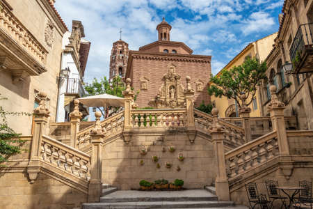 Staircase leading to the Cathedral of Santiago in the city of Santiago de Compostela in Galicia, against the tower of the church of Santa Maria in the city of Utebo, Torre del Uteboの写真素材