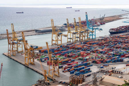 Barcelona, Spain - September 21, 2021: Barcelona container port. Containers in the city port. Barcelona is a major european port.のeditorial素材