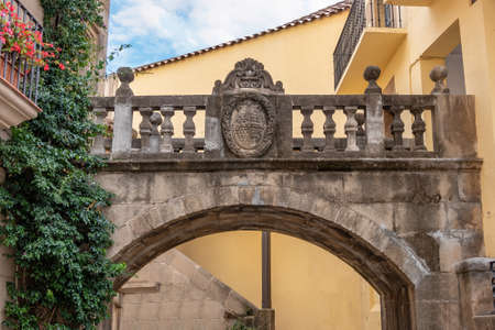 Arch And Bridge Fefinhanes Y San Benito, Cambados, Pontevedra, Galicia in Poble Espanyol, Spanish Village in Barcelona, Catalonia, Spain.の写真素材