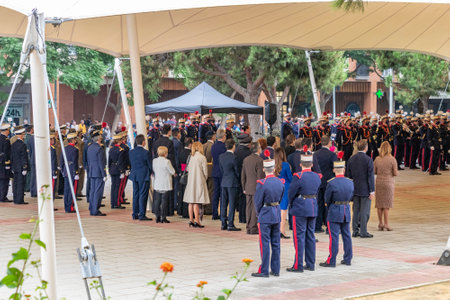 Huelva, Spain - October 30, 2021: Spanish Royal Guard and civilians under a tent on a rainy day prior to the pledge of allegiance to the Spanish flag of civilians who so wishの写真素材