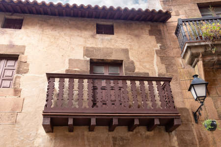 Typical wooden balcony in Poble Espanyol, Spanish Village in Barcelona, Catalonia, Spain.の写真素材