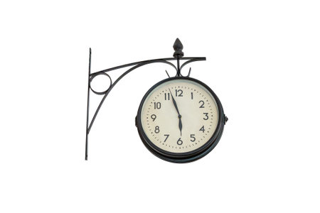old wall clock over a white wallisolated on white backgroundの写真素材