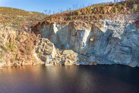 PeÃ±a del Hierro open mine pit. Deep excavation of pyrite and extraction of minerals of copper and gold in municipality of Nerva, Huelva, Andalusia, Spainの写真素材