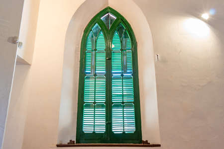 Huelva, Spain - December 18, 2021: Detail of window of Anglican Church of Bella Vista used by the staff of the Rio Tinto Company Limited, in Minas de Riotinto, Huelva, Andalusia, Spainのeditorial素材